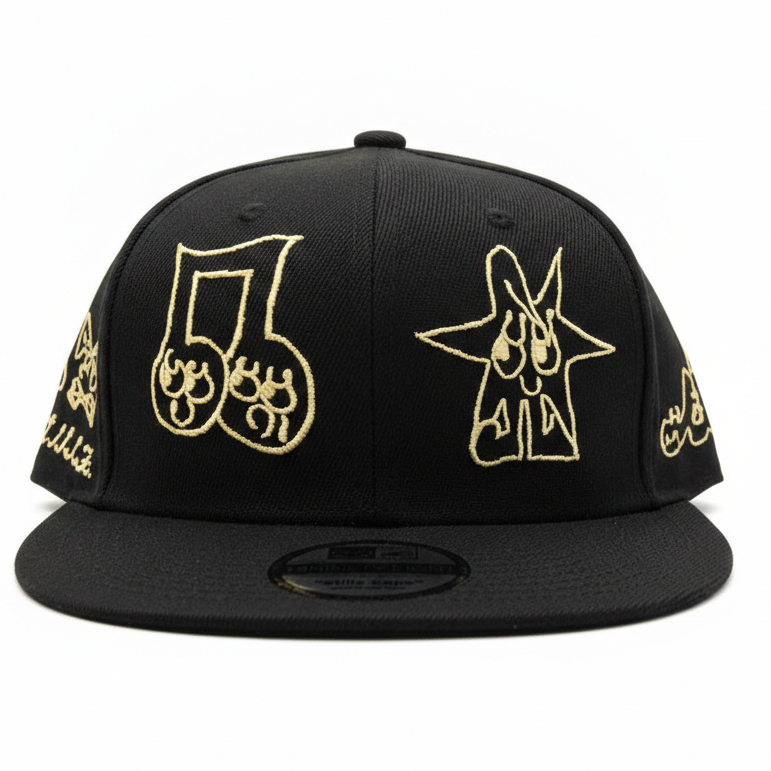 Black cap with gold embroidered designs on a white background