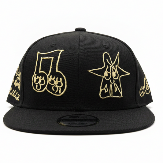 Black cap with gold embroidered designs on a white background